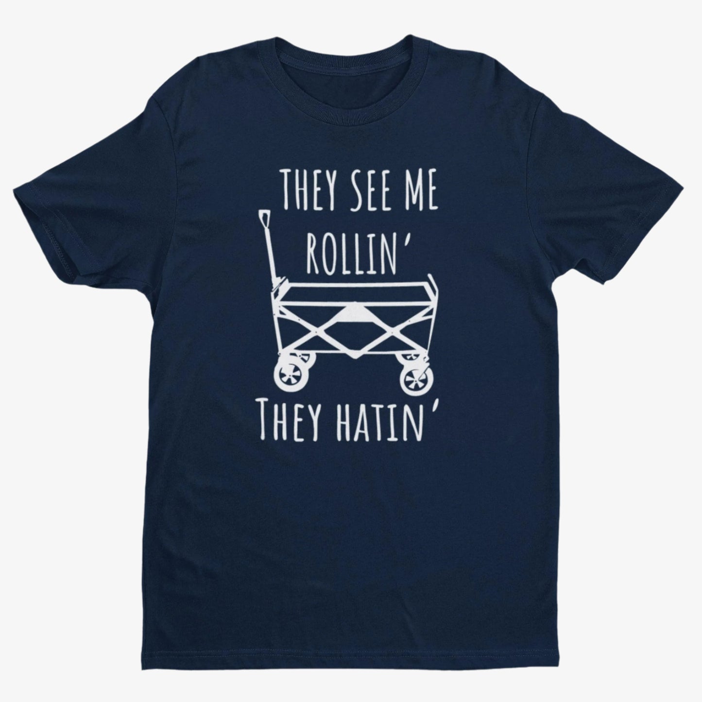 Navy blue t-shirt with white graphic playful design featuring a classic wagon graphic with the bold phrase, "They See Me Rollin' They Hatin'" on a white background