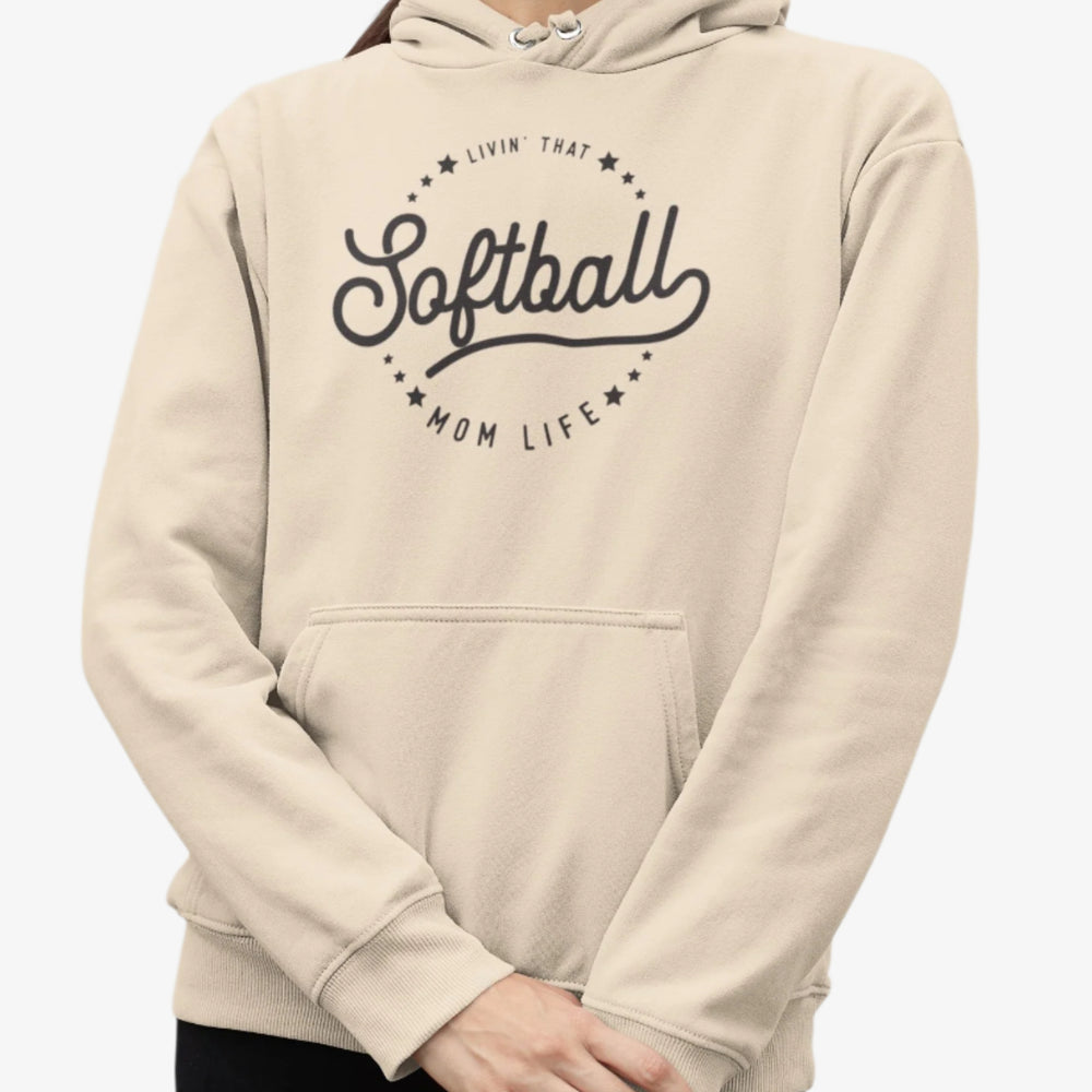 Person wearing a beige hoodie with 'Livin that Softball Mom Life' text on a white background