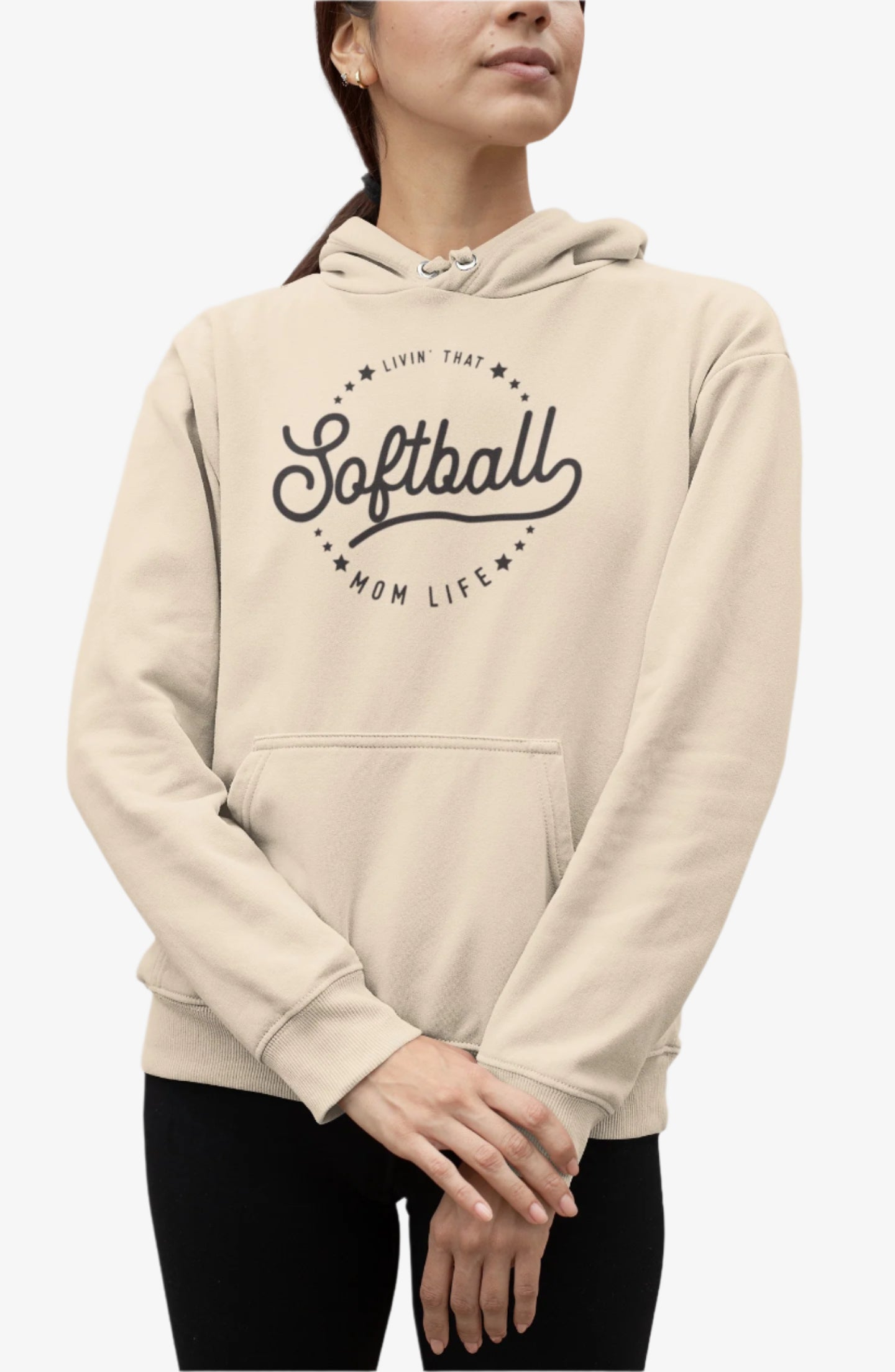 Person wearing a beige hoodie with 'Livin that Softball Mom Life' text on a white background