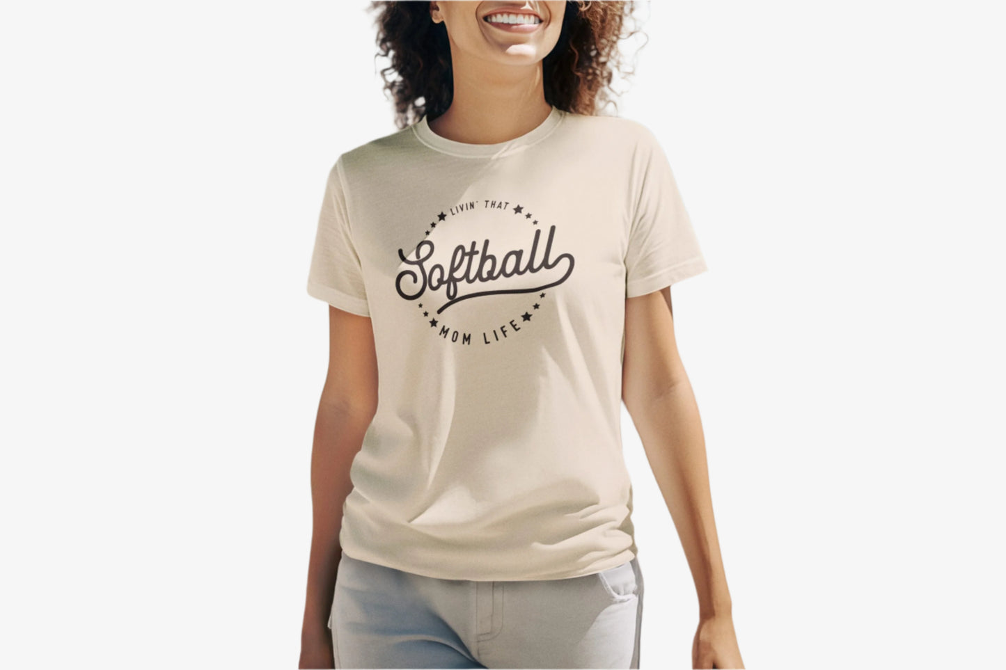 Woman wearing a 'Softball is my life' t-shirt on a beach.
