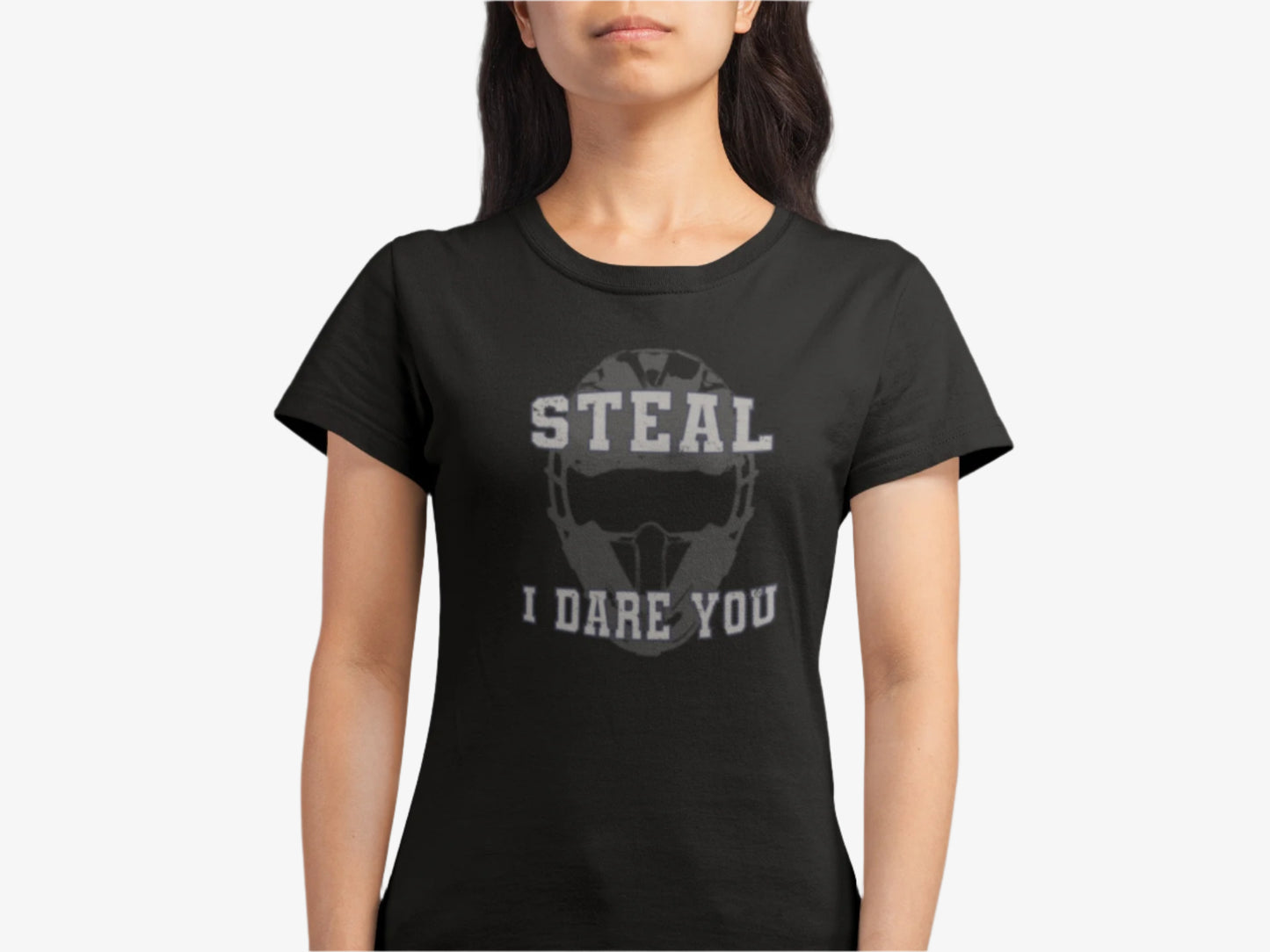 Person wearing a Black t-shirt with graphic design that features a catcher's mask and the daring words, "Steal I Dare You" on a white background