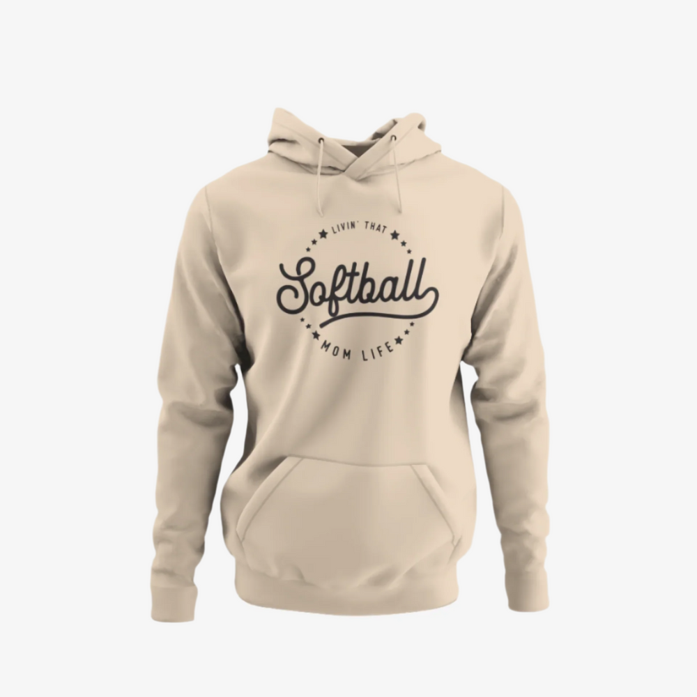 Beige or tan-colored hoodie with a sleek black font that reads "Livin' That Softball Mom Life" emblazoned on the front.